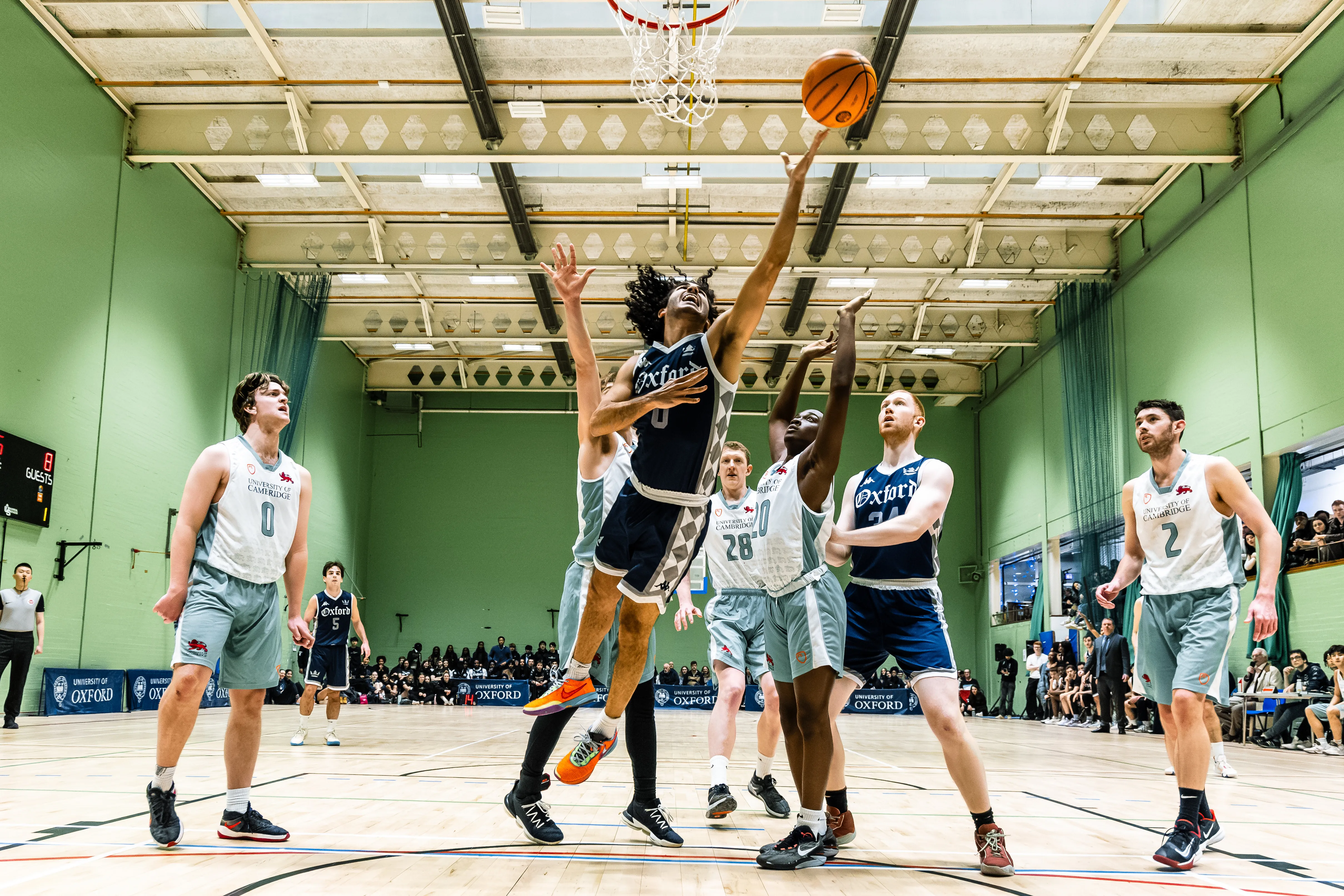 OUBbC player shooting over a Cambridge defender