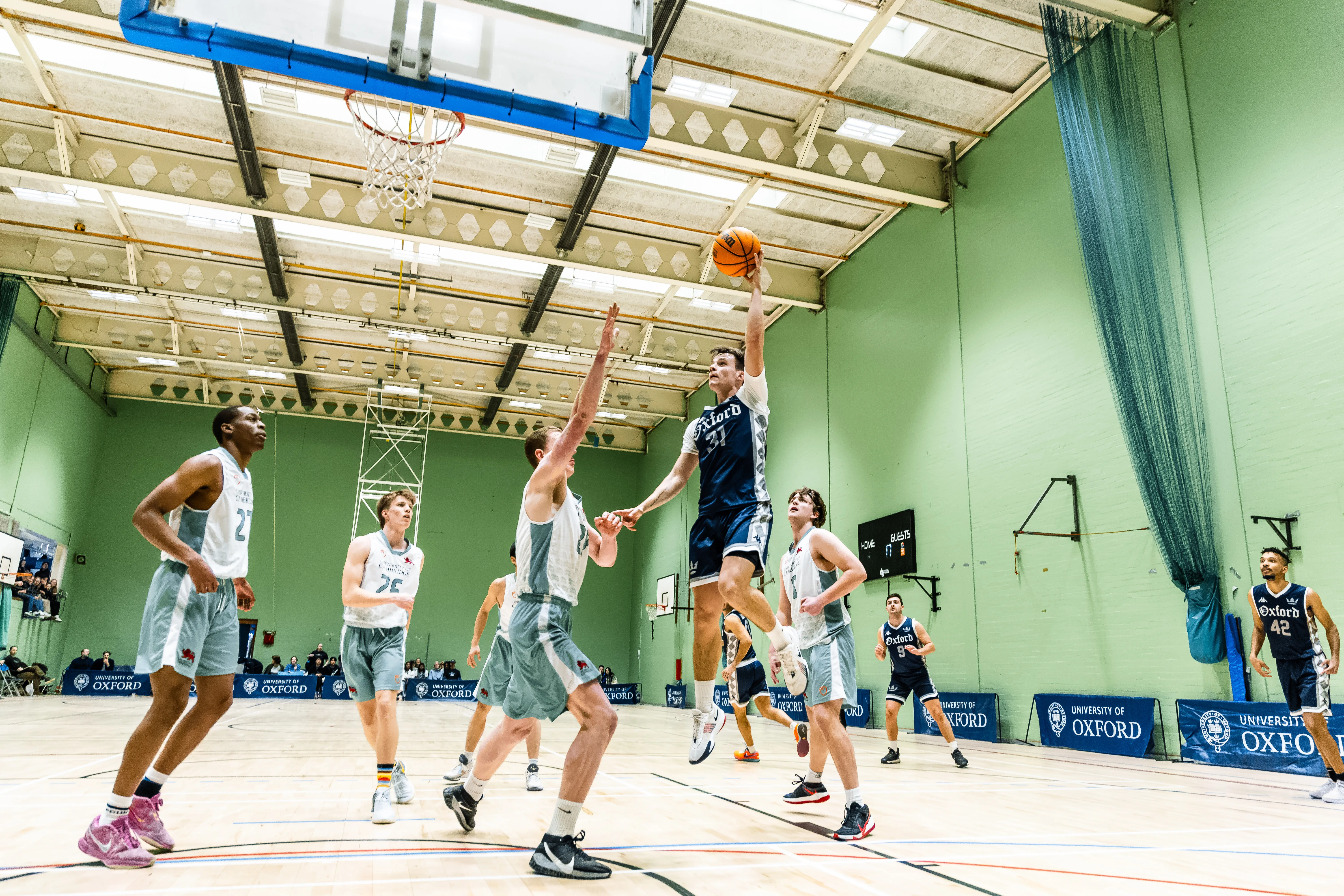 OUBbC player driving to the basket in traffic