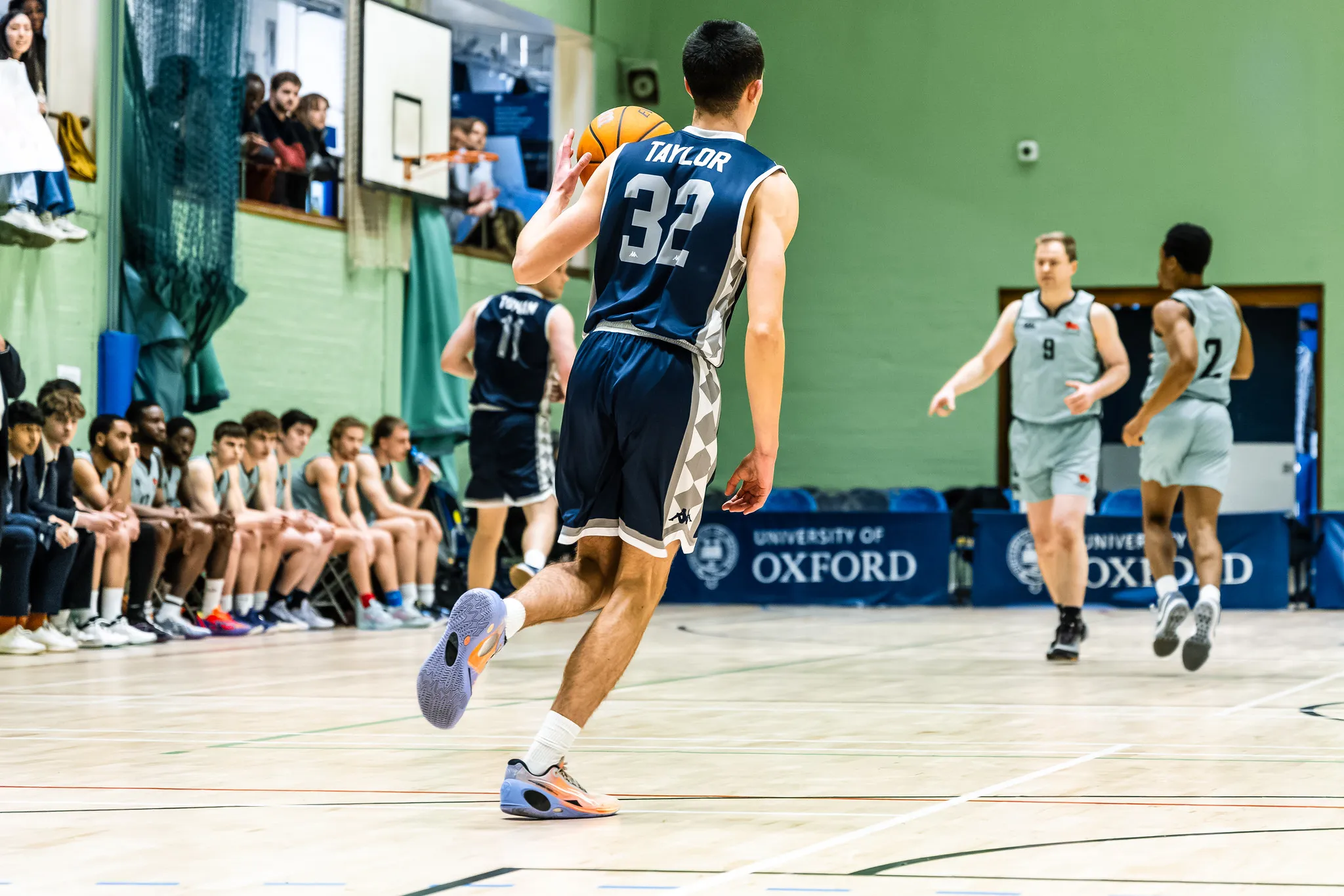 OUBbC player with the ball, teammates in support